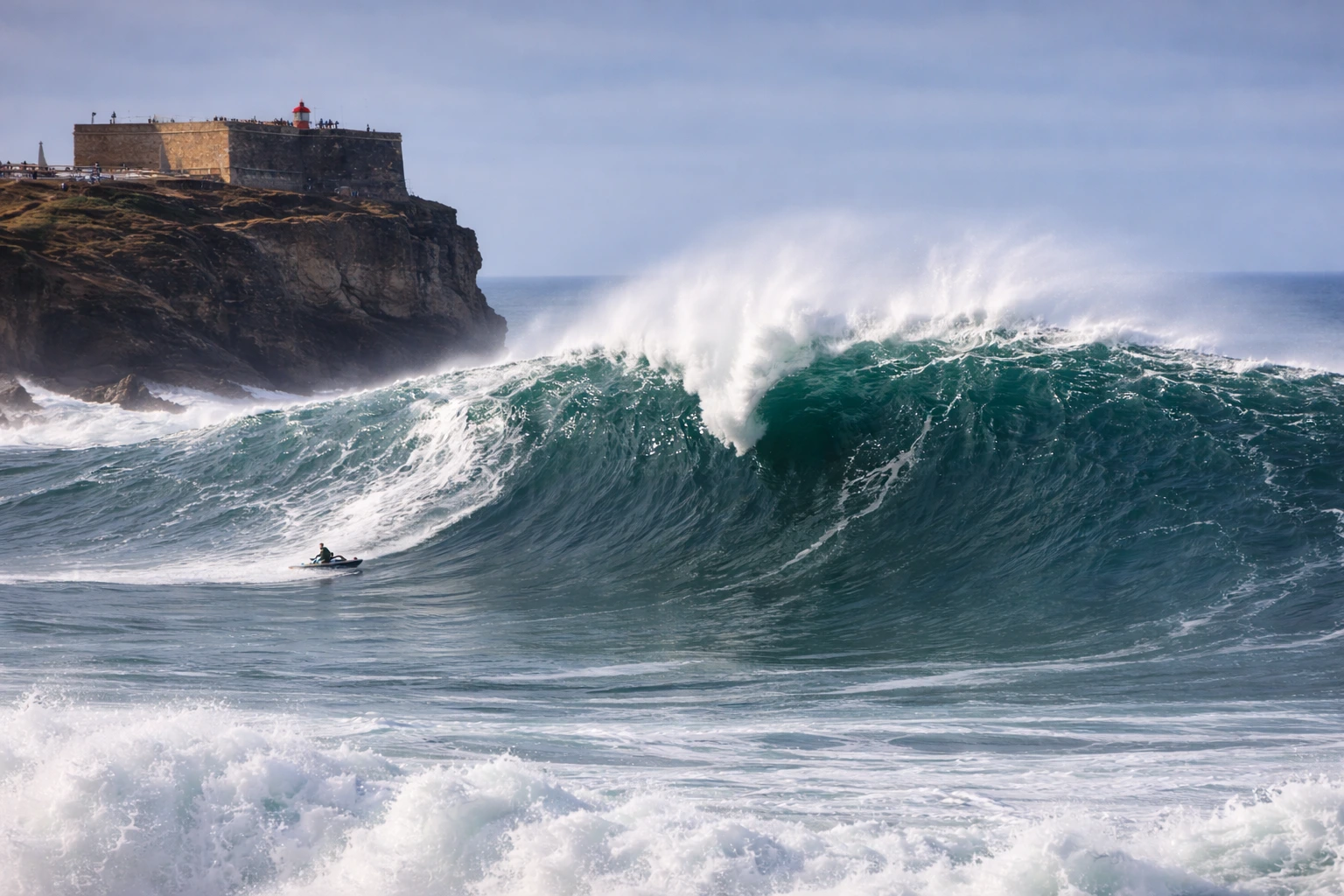 Giant wave breaking at Praia do Norte in Nazaré, Portugal during big wave season